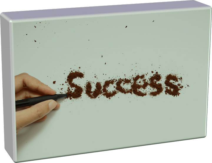 A picture of a hand writing the word success